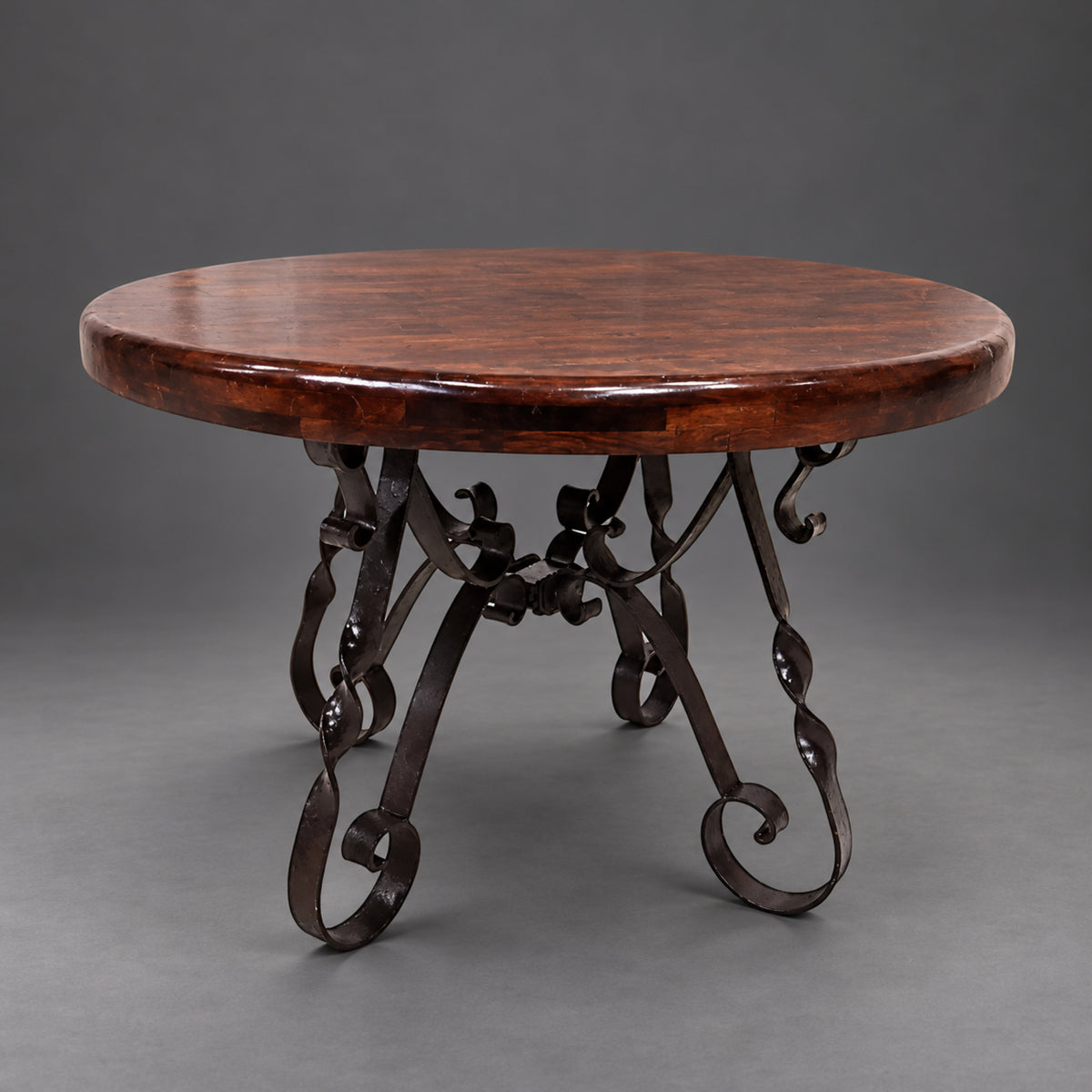 1212D round mesquite dining table with decorative hand-forged iron scroll base