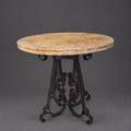 Round Travertine Table with Ornate Iron Pedestal | 1251 E