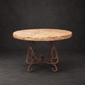 Round Peach Travertine dining table with a chiseled edge and ornate brown iron base, model 1240 D,