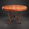 1211D round natural copper dining table with hand-forged iron scroll base